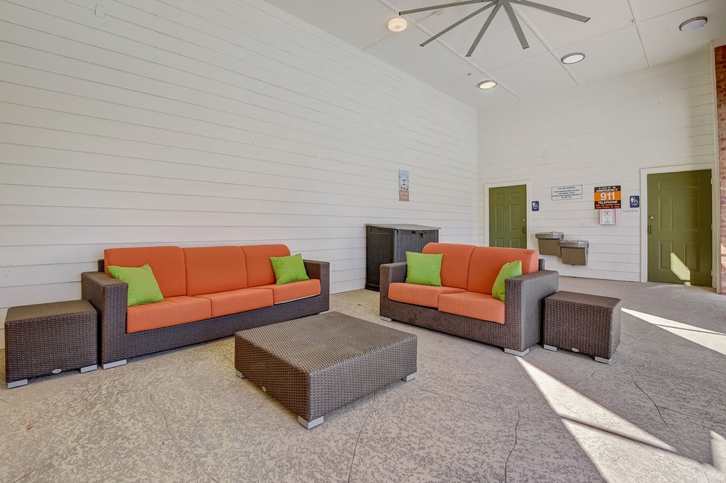 a living room with couches and chairs and a table