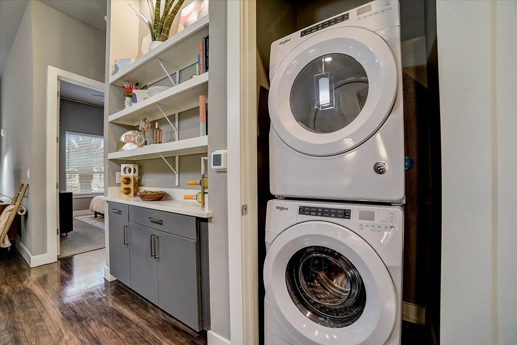 a small laundry room with a washing machine and a dryer