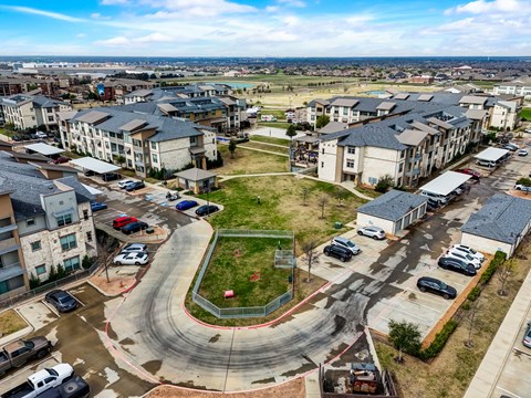 an aerial view of a neighborhood with houses and cars