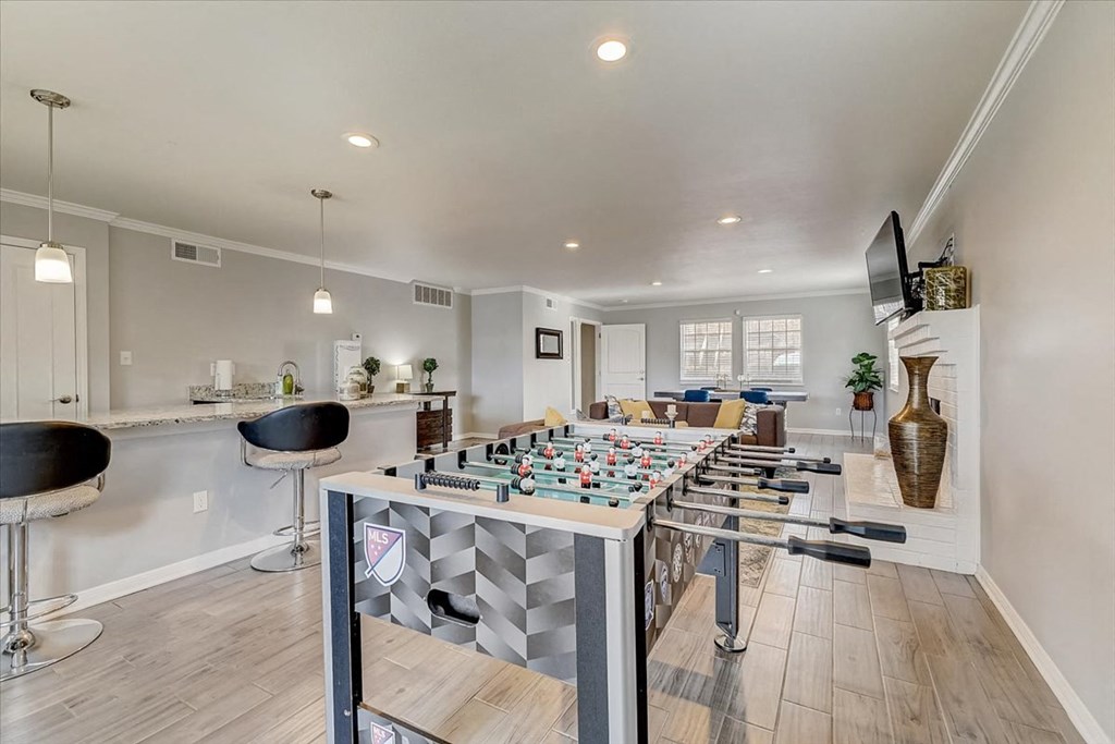 a game room with a bar and a chess board
