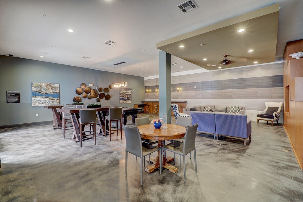 a living room with a dining room table and a couch