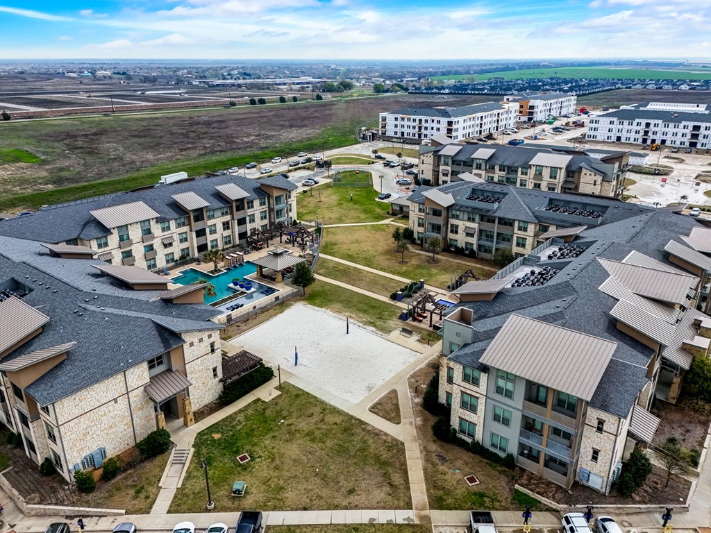 an aerial view of a group of apartment buildings in a city