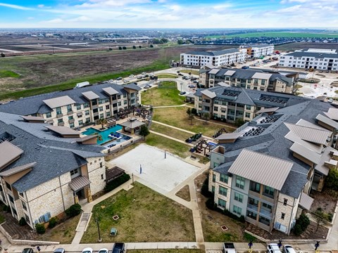 an aerial view of a group of apartment buildings in a city