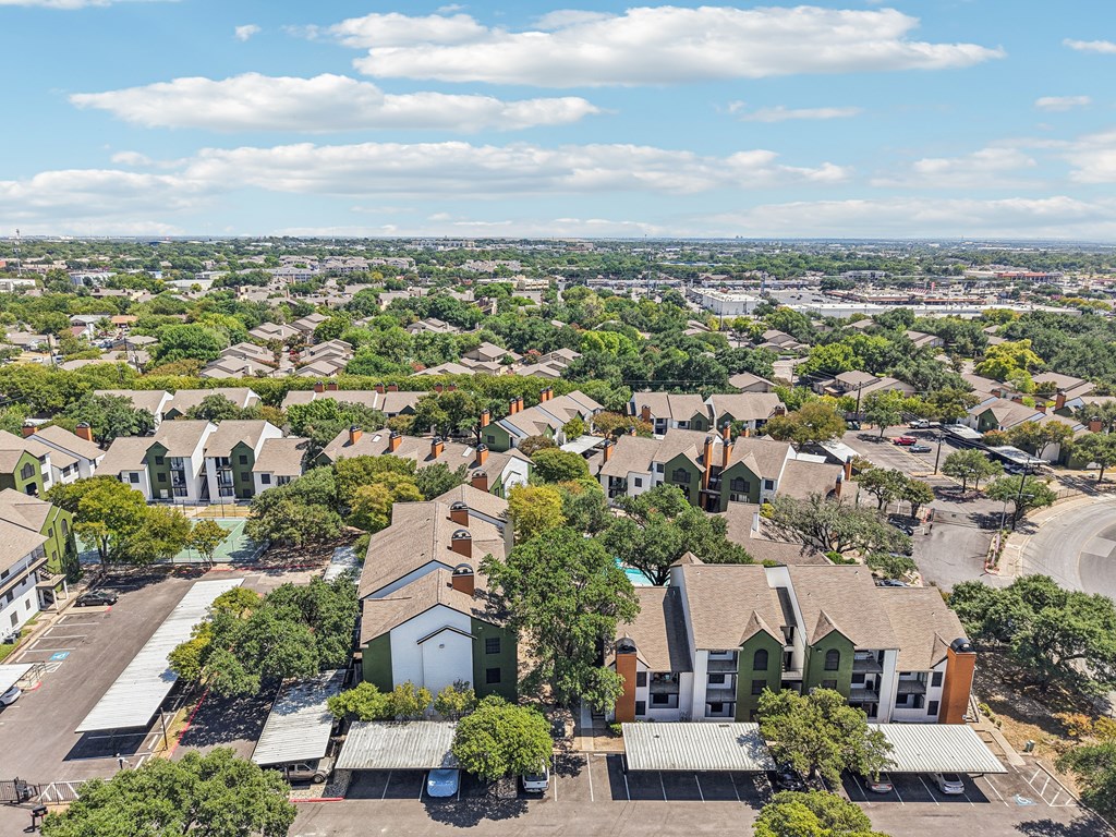 A bird's eye view of a residential area with houses and trees.