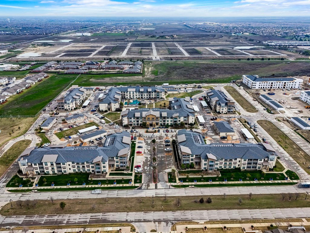 an aerial view of a group of buildings and an airport