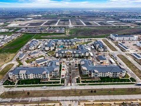 an aerial view of a group of buildings and an airport