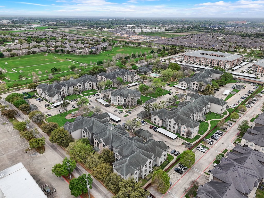 an aerial view of a group of houses in a suburb