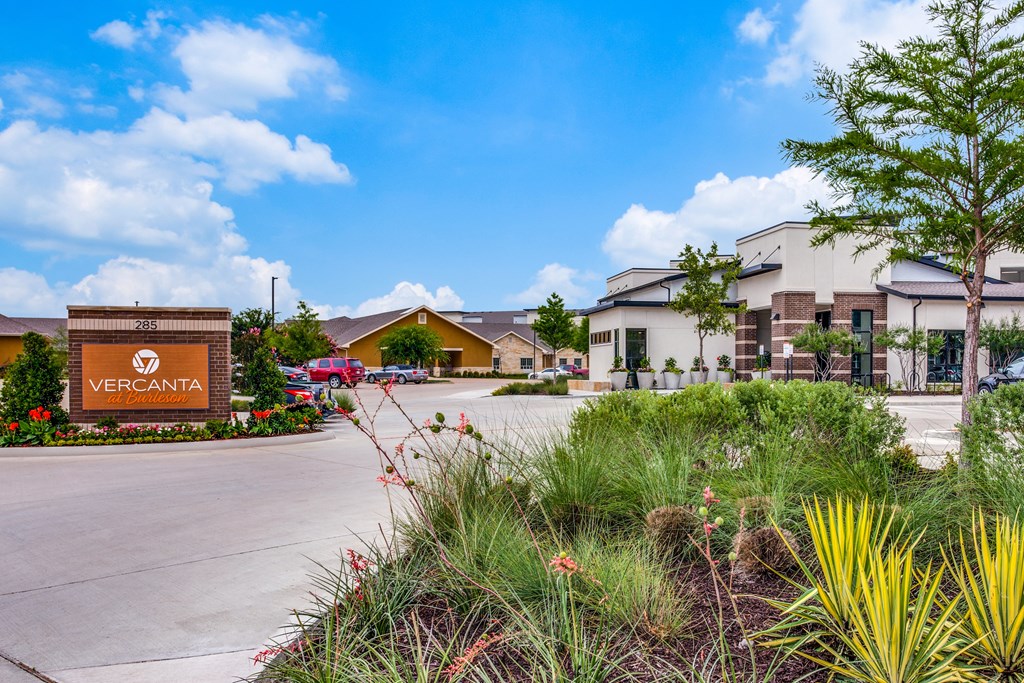 A sign that says VERCANTA in front of some buildings.