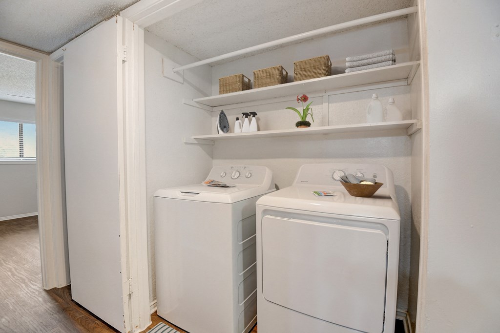 a small laundry room with a washer and dryer