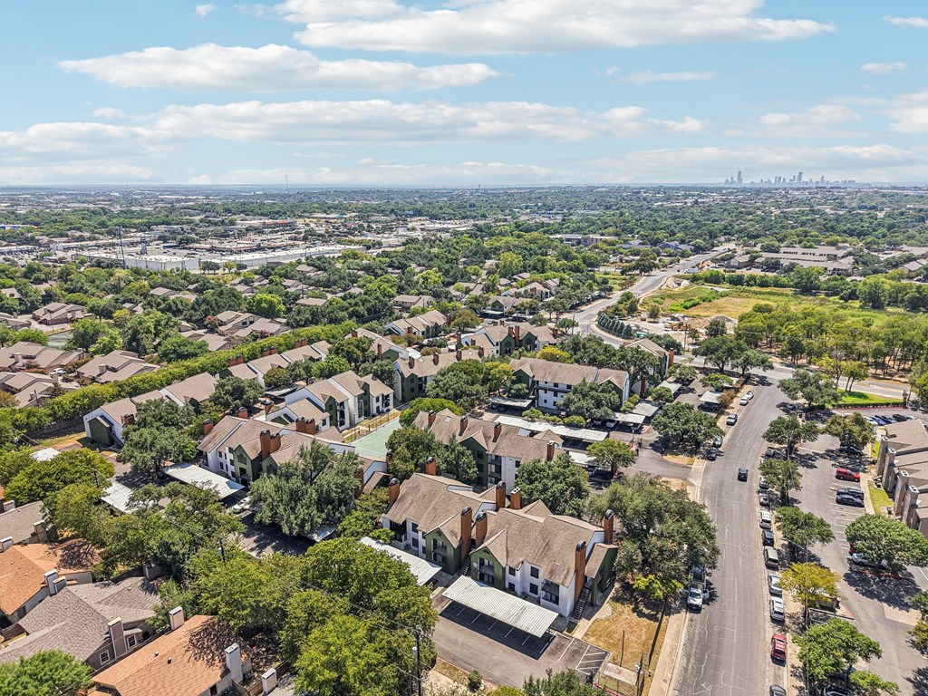 A suburban neighborhood with houses and trees.