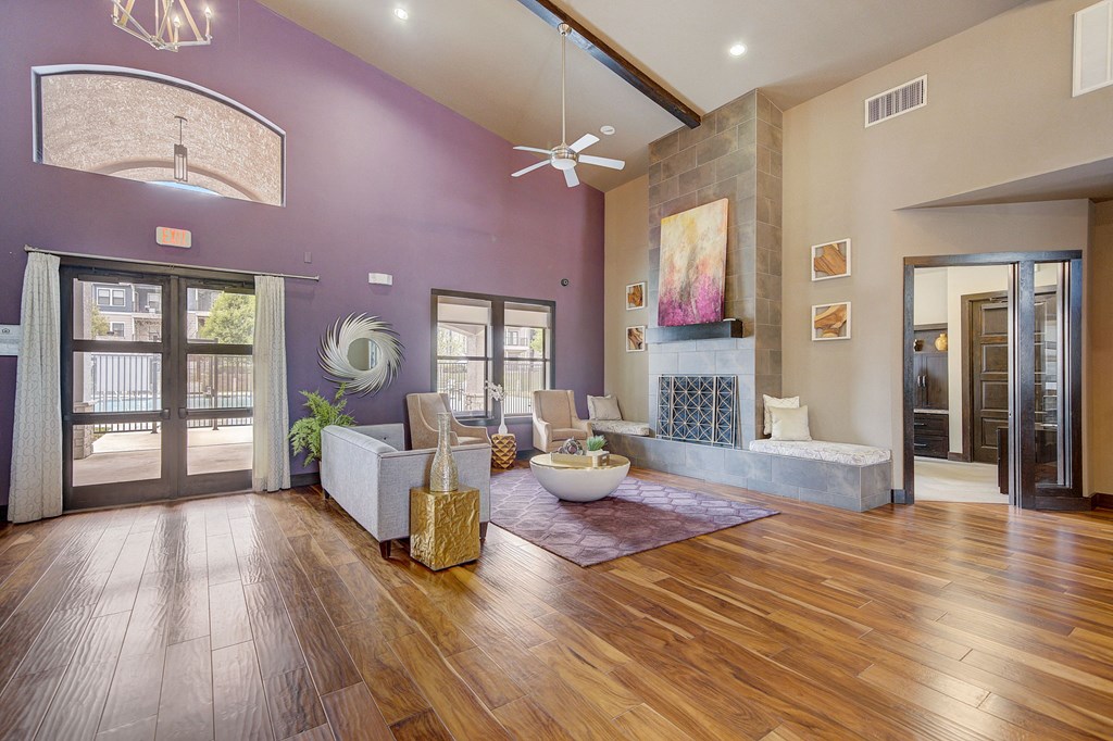 the preserve at ballantyne commons living room with purple walls and wood floors