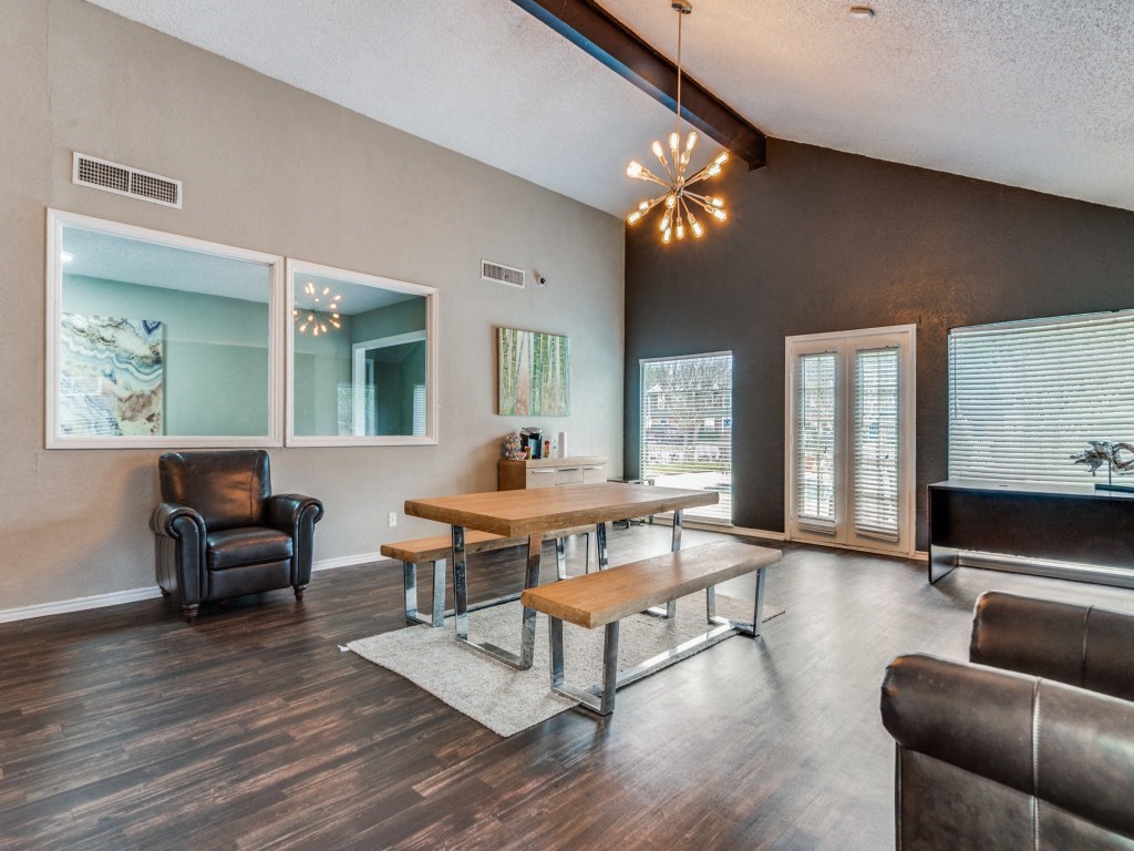 a living room with a dining room table and a couch