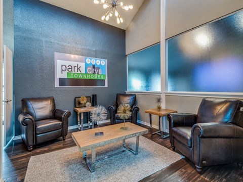 A living room with a sign that says