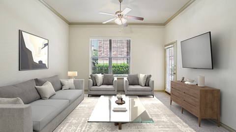 A modern living room with a grey sofa, a coffee table, and a flat-screen TV mounted on the wall.