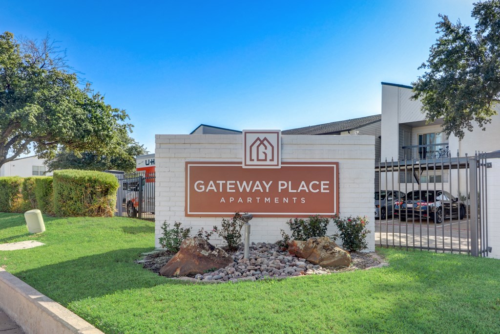 the gateway place apartments entrance sign in front of a building