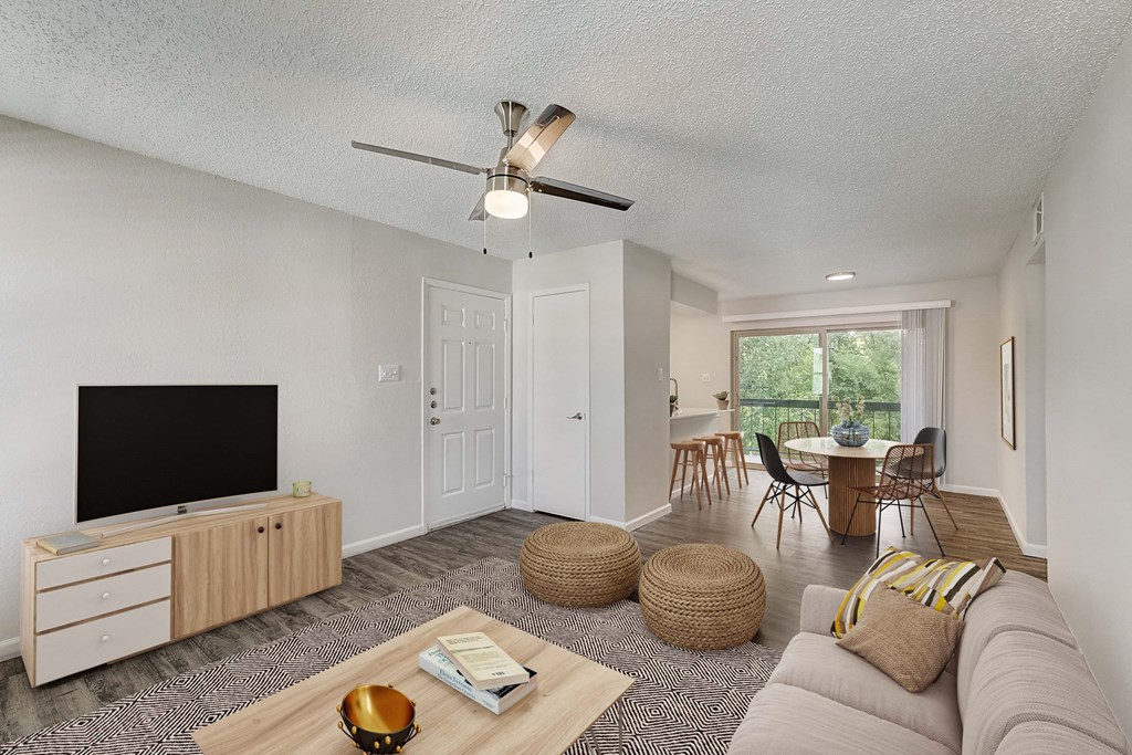 a living room with a couch and a table in the background