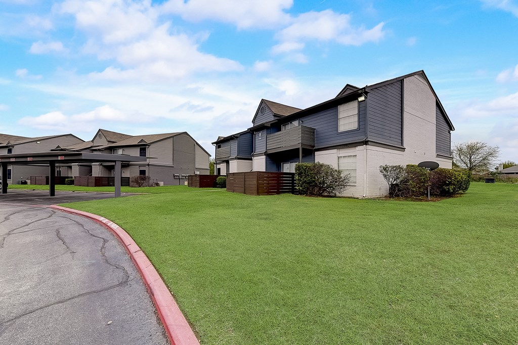 a row of houses on the side of a road