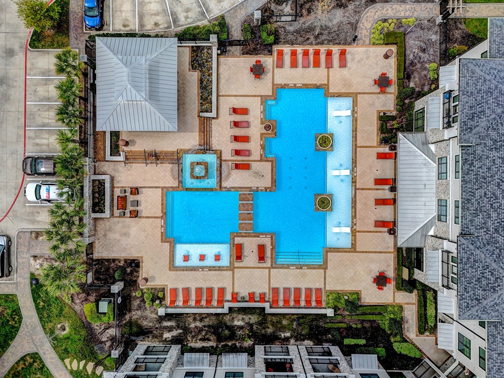 arial view of a large swimming pool in a residential yard