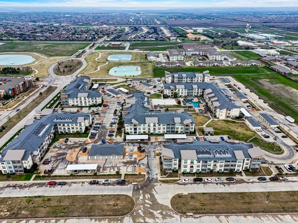 an aerial view of a city with buildings and roads