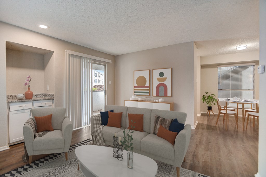 a living room and dining room with a couch and a table