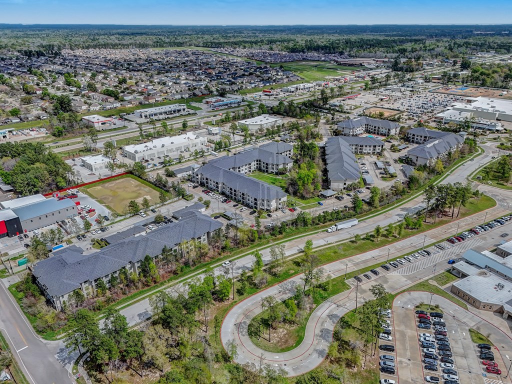 an aerial view of a city with many buildings and roads