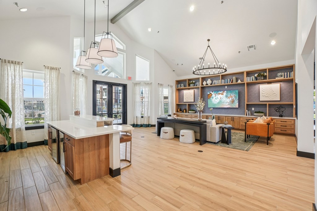 A kitchen with wooden floors and a large island.