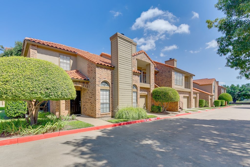 a house with a driveway and a street in front of it
