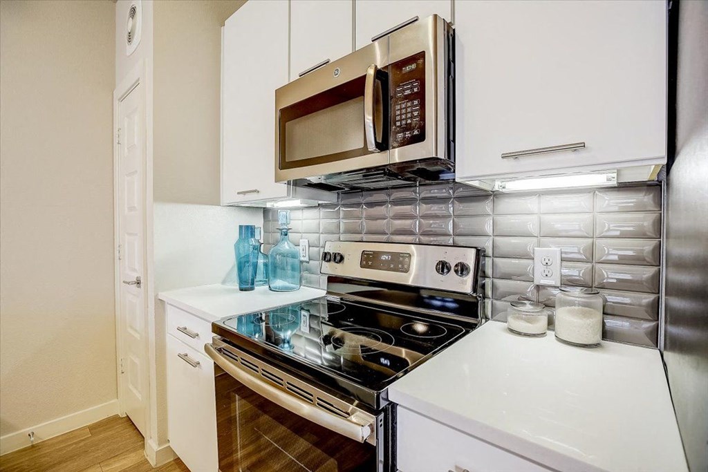 a kitchen with a stove and a microwave