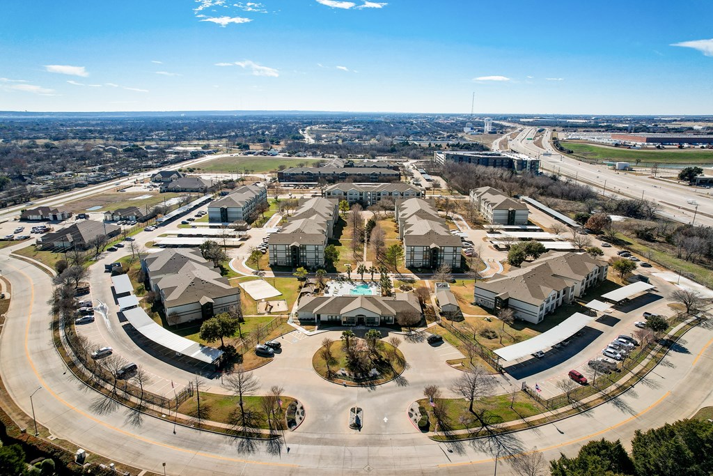 an aerial view of a neighborhood with houses and roads