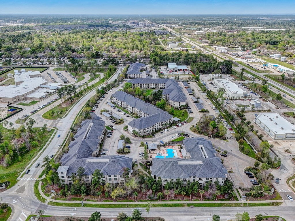 an aerial view of a city with many buildings and trees