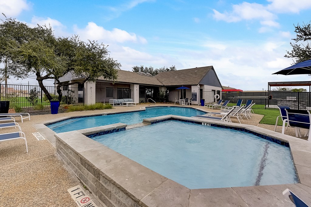 the preserve at ballantyne commons pool and spa with patio furniture and a house