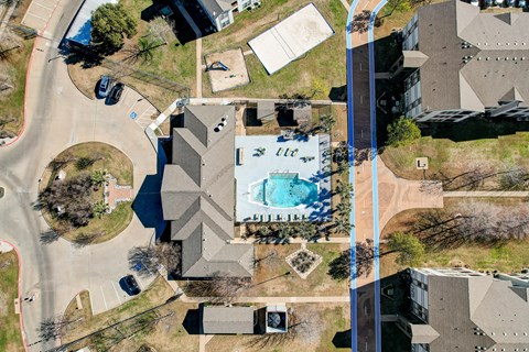 an aerial view of a house with a pool on its roof