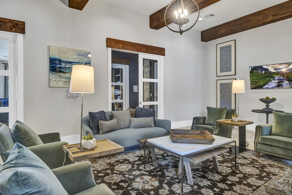 a living room with couches and chairs and a coffee table