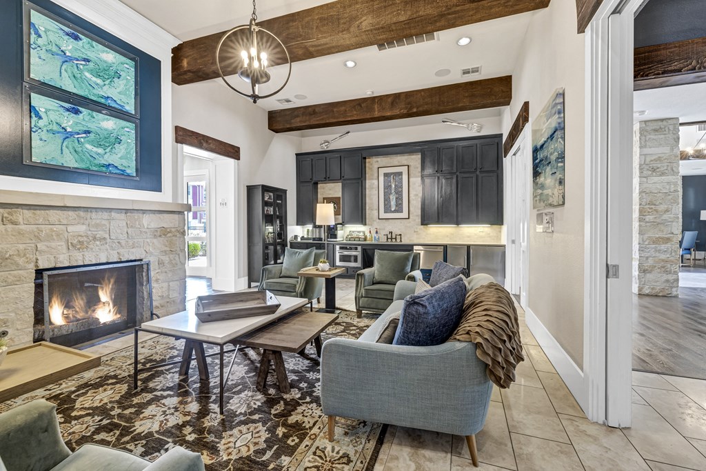 a living room with couches and chairs and a fireplace