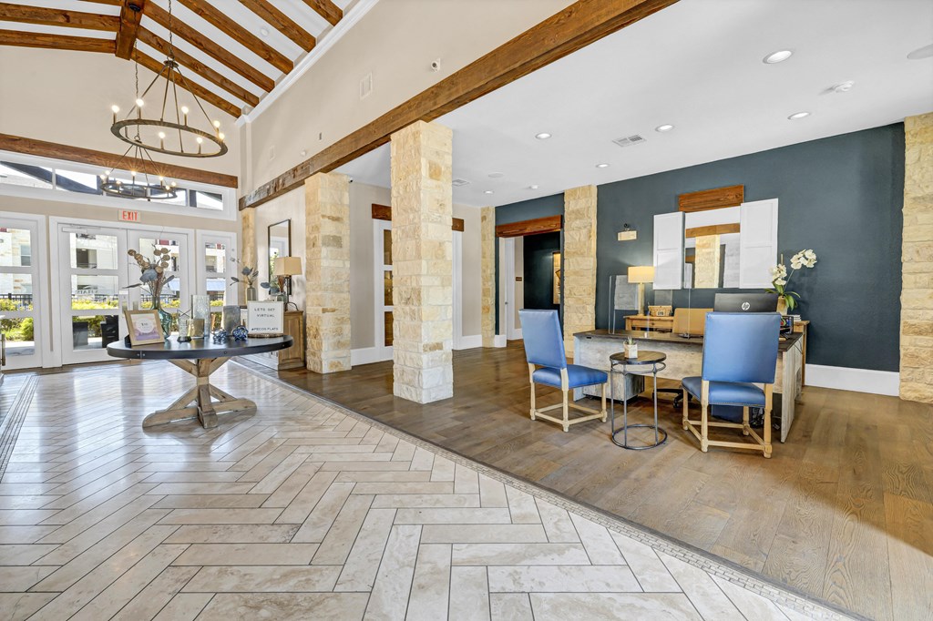 a lobby with a dining area and a table with chairs