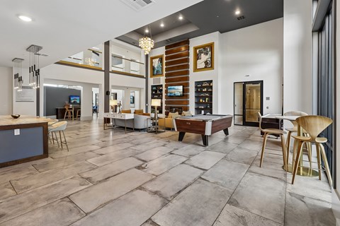 A modern living room with a wooden floor and furniture.