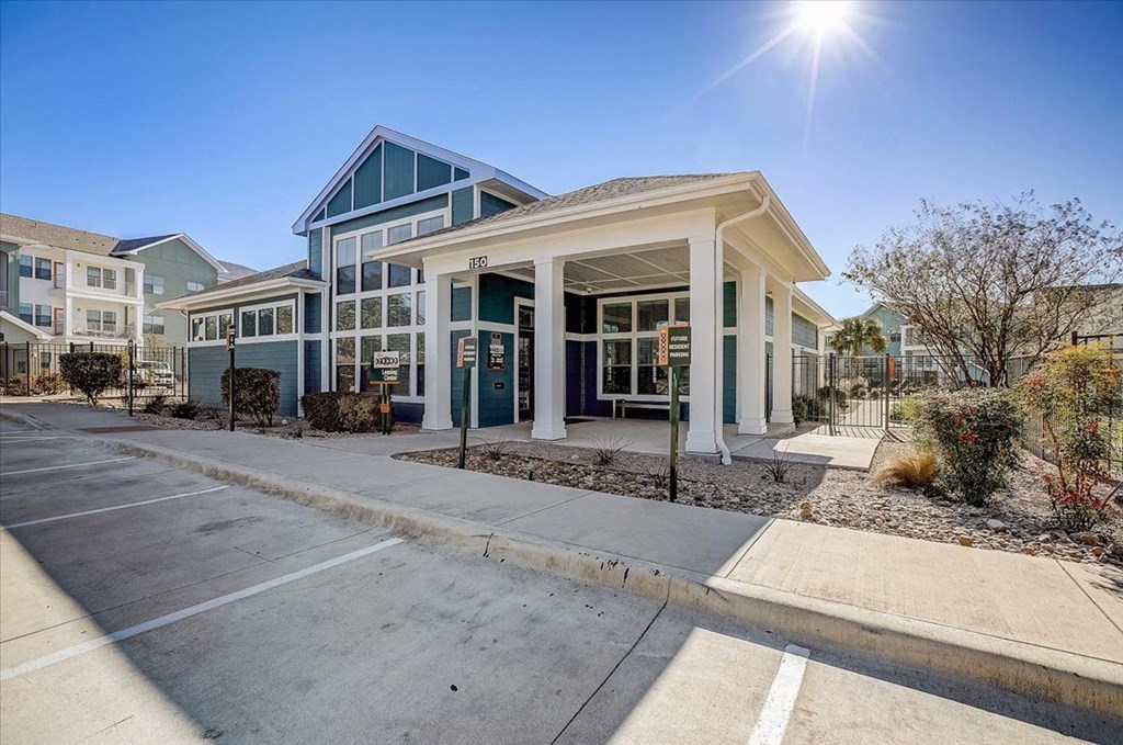 an empty parking lot in front of a building
