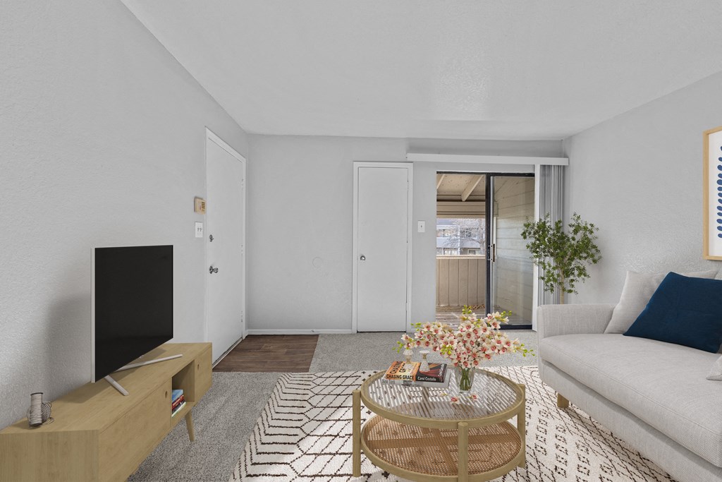 a living room with a white couch and a coffee table