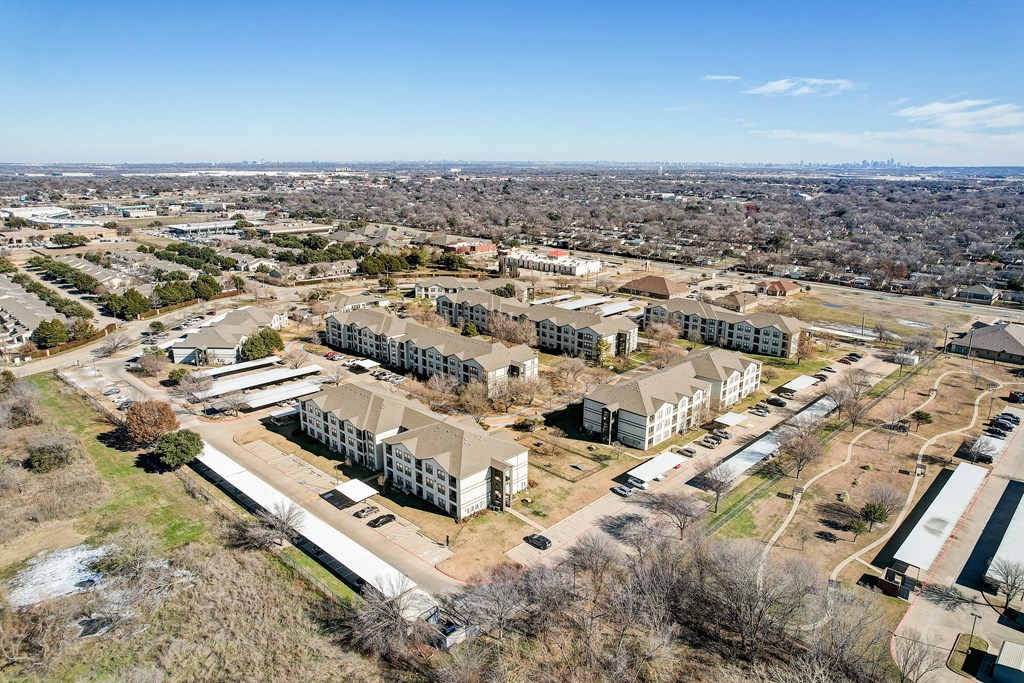 an aerial view of a city with houses and buildings