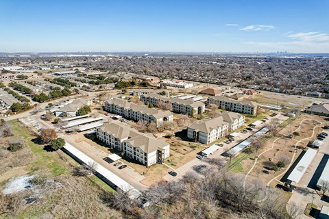 an aerial view of a city with houses and buildings