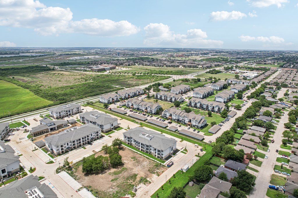 A bird's eye view of a residential area with houses and apartment buildings.