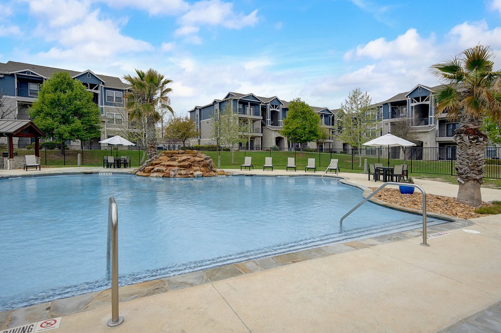 the preserve at ballantyne commons pool with apartment buildings
