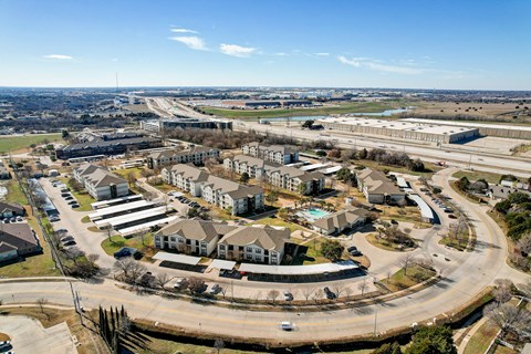 an aerial view of a neighborhood with houses and roads