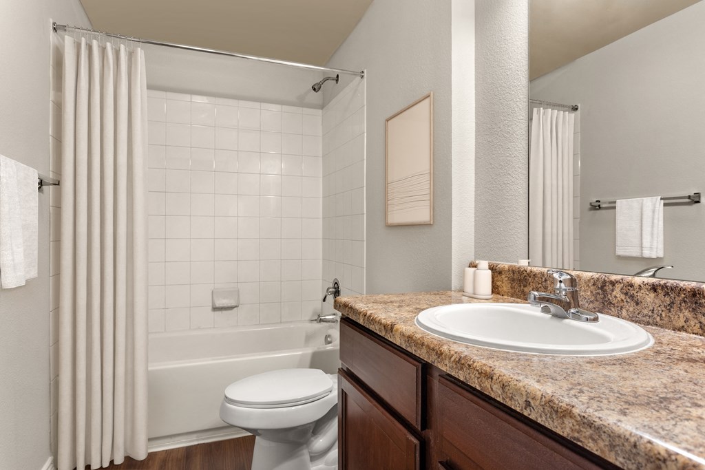 a bathroom with a bathtub and a sink