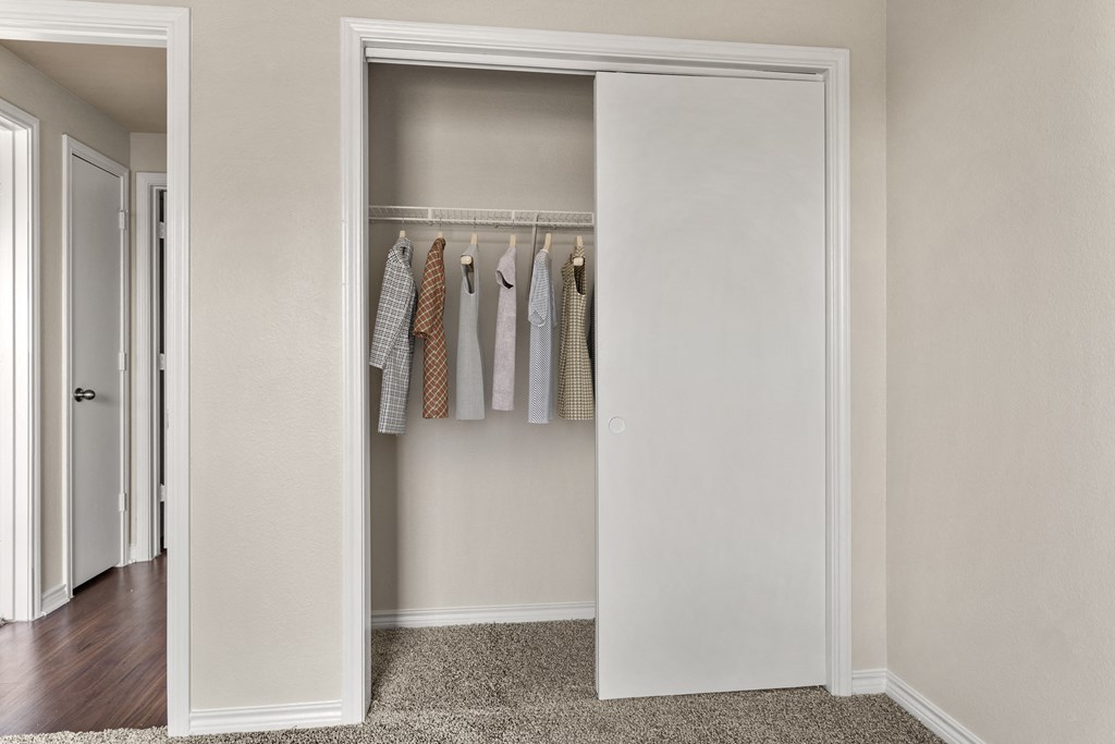 a walk in closet in a 555 waverly unit