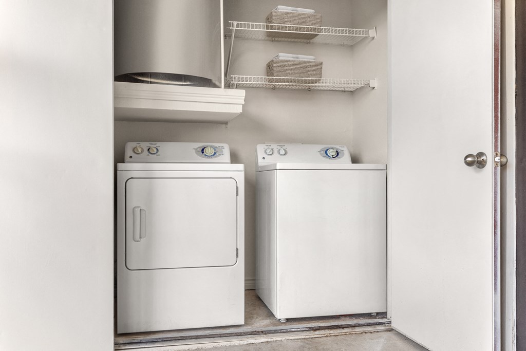 a small laundry room with a washer and dryer
