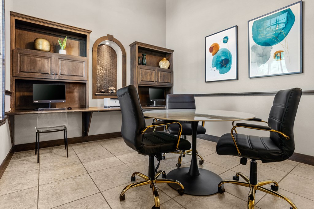 a meeting room with a table and chairs