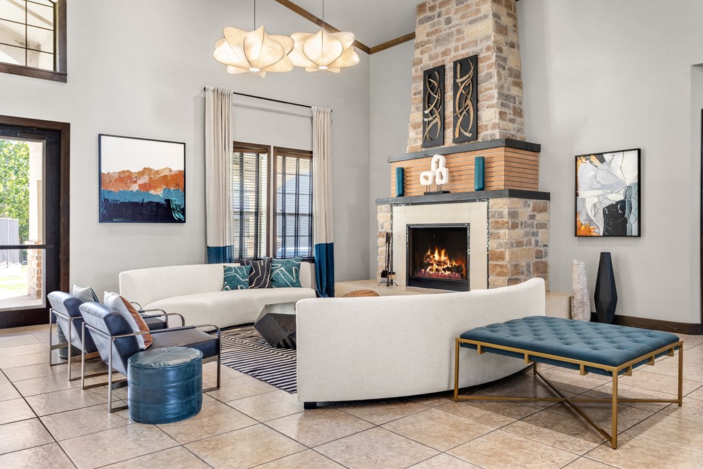 a living room filled with furniture and a fireplace