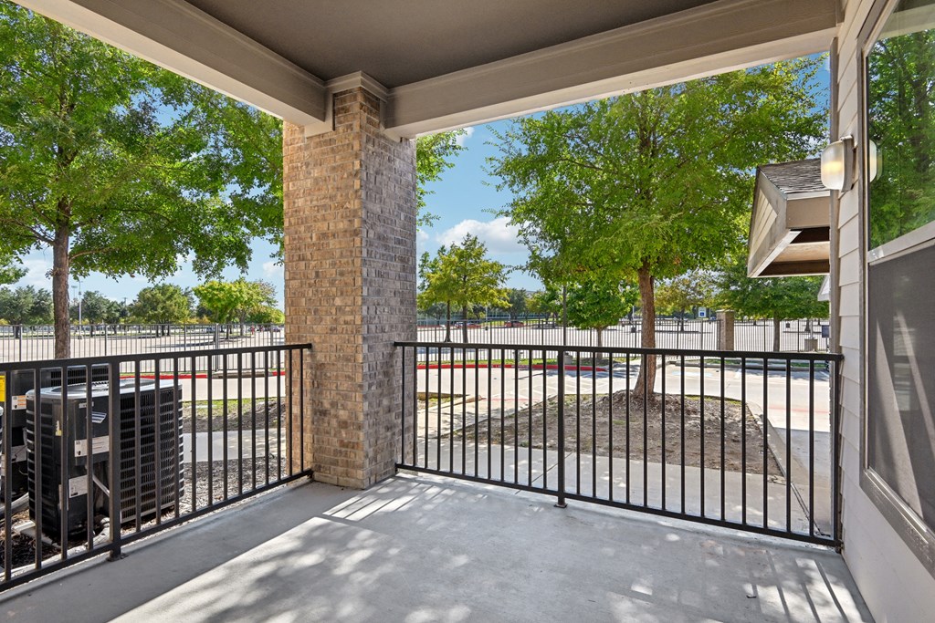 the preserve at ballantyne commons community balcony with metal fence and trees