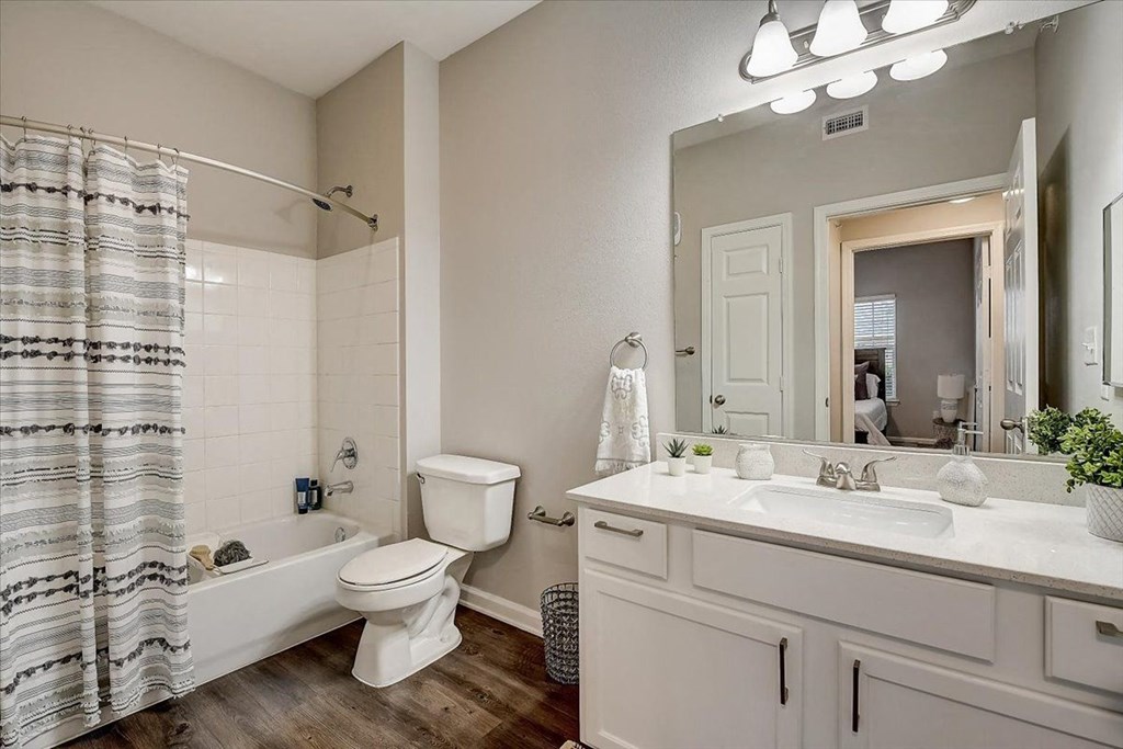 a bathroom with a bathtub toilet and sink